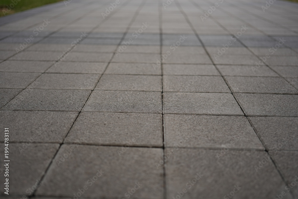 Obraz premium grey paving tile texture, grey tile pattern as background, grey tile texture close up 