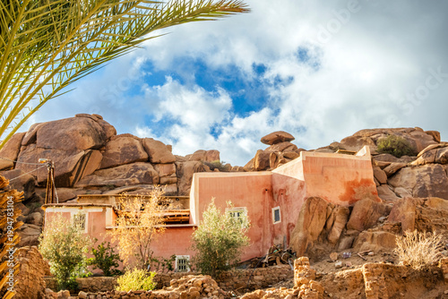 Bild auf Leinwand Houses built on the stones, integrated into the buildings, in village of Tafraou
