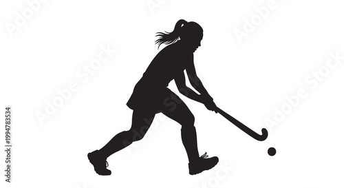 Silhouette of a female field hockey player in action with ball