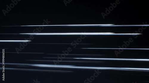 Motion blur stretches across a dark background, with vivid blue streaks cutting through the scene to convey intense speed and fast, abstract movement