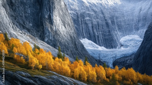 Vibrant autumn foliage ablaze with color against a majestic rocky mountain and distant glacier.