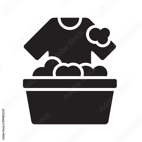 Solid vector illustration of a wash basin filled with soapy water and clothes, symbolizing hand washing.