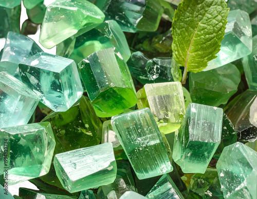 Emerald green rough crystals and a mint leaf