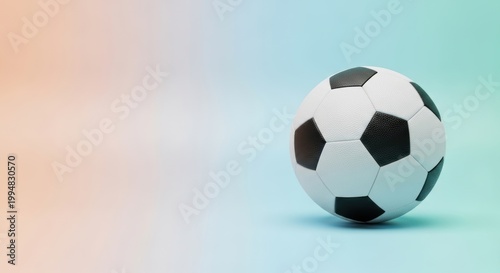 Classic soccer ball on a soft gradient background with copy space for sports themes