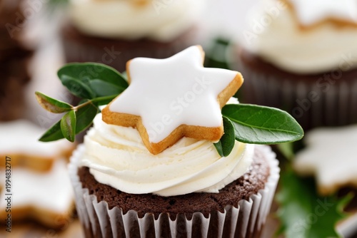 Festive Cupcake With Cream Icing and Gingerbread Star on Top in Holiday Setting