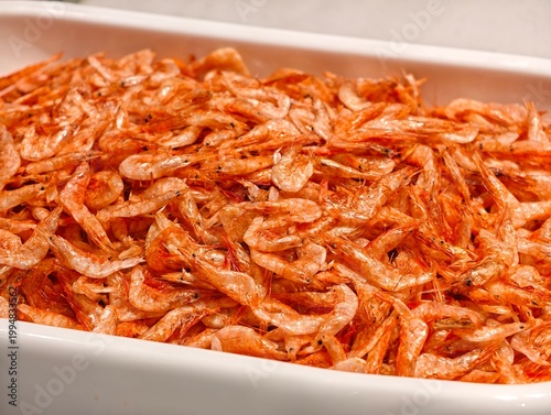 Close-up dried shrimp (Acetes), bright orange-red color.