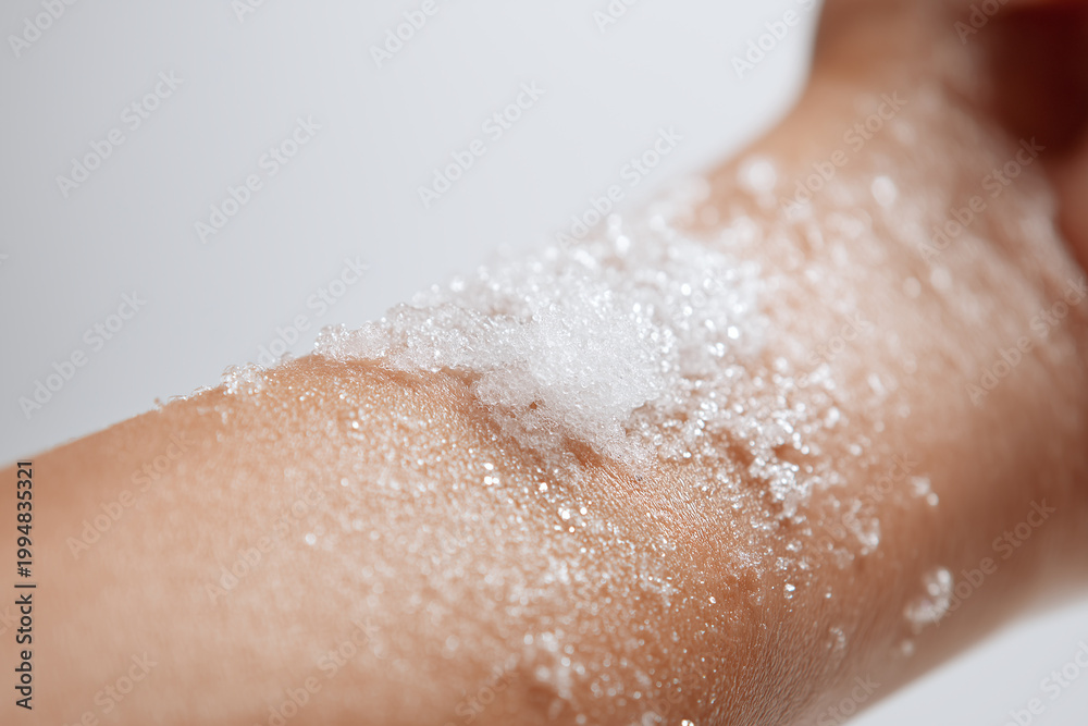 Fototapeta premium Sparkling gel on forearm skin texture closeup soft foam on arm with water droplets and shimmer