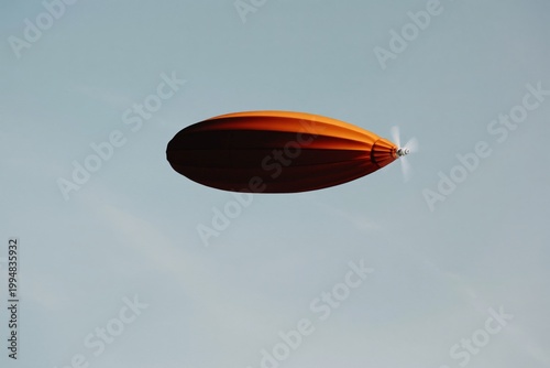 Hot Air Balloon Floats in Blue Sky During Clear Daytime Near Open Fields