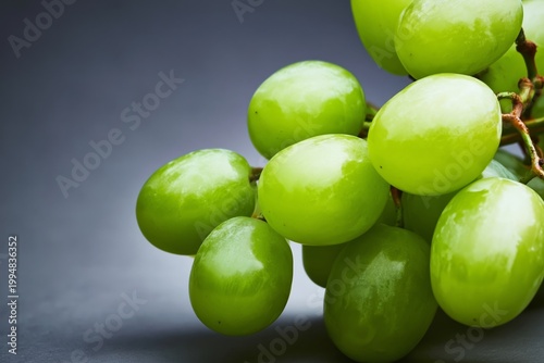 Fresh Green Grapes Close up on a Dark Background With Natural Light Shining T...