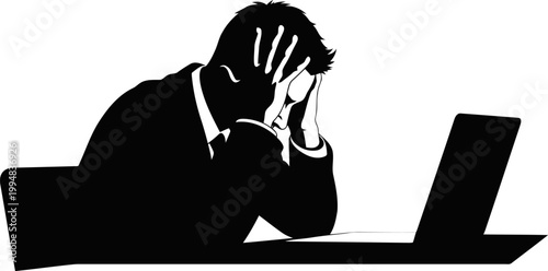 A freelancer working late night at laptop silhouette.