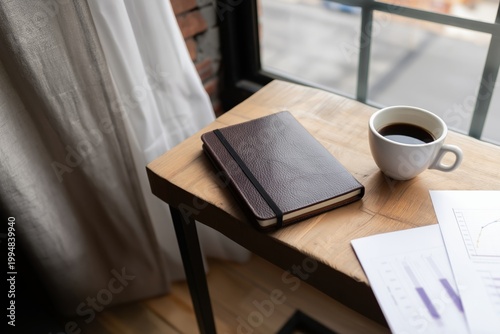 Coffee Cup and Notebook on Wooden Table Near Window in Caf During Morning Hours