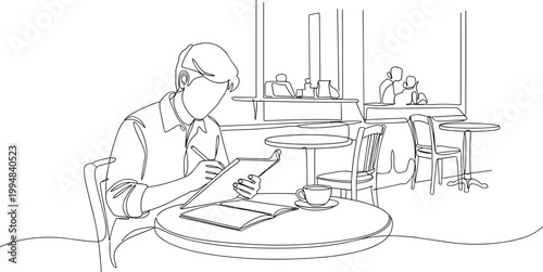 Man Working in Cafe, Drawing or Writing at Table with Coffee