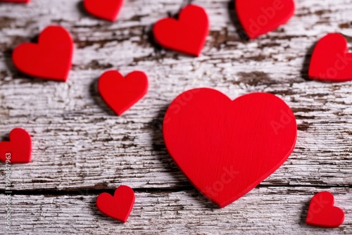 Red Heart Cushion With Smaller Hearts on Wooden Table for Decoration