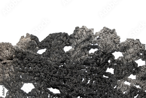 Close up of vintage black gothic lace fabric white on black background embroidery