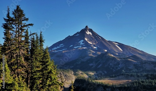 Bild auf Leinwand Crisp Morning View of Mount Jefferson Rising Above Subalpine Ridges and Dense Co