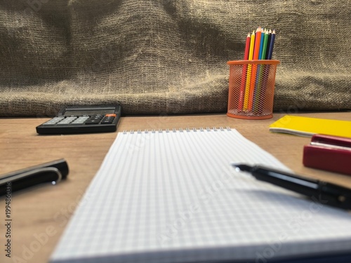 Stationery items laid out on a flat background. Education concept.