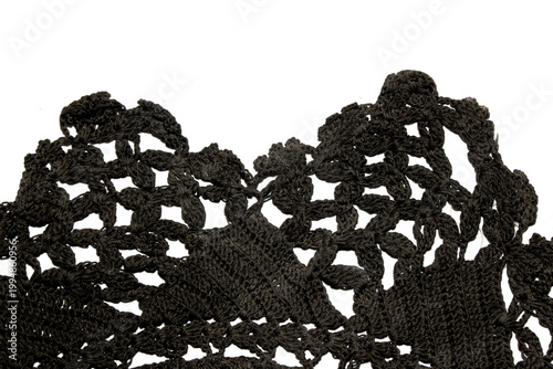 Close up of vintage black gothic lace fabric white on black background embroidery