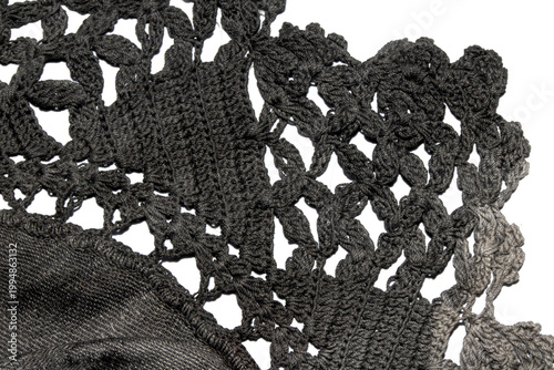 Close up of vintage black gothic lace fabric white on black background embroidery