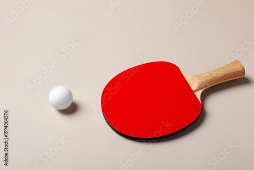 Table Tennis Paddle and Ball on a Simple Surface Ready for a Game