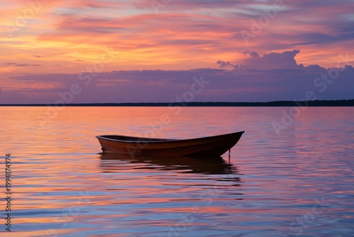 Boating on Calm Water at Sunset With Colorful Sky and Reflections