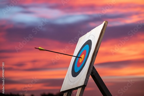 Target Practice at Sunset With Arrow Hitting Bullseye in the Sky
