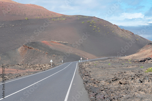Road in Lanzarote mountain volcanic landscape, Canary island, Spain