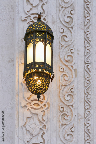 Ornamental Arabic Lantern on Carved Marble Wall in Sheikh Zayed Mosque, UAE