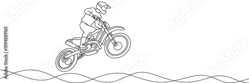 Motocross rider jumping on a dirt bike