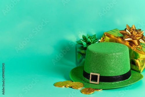 Celebration Items for a Festive Event With Green Hat, Gold Coins, and Wrapped...