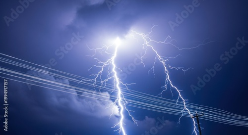 Intense lightning strikes illuminate dark clouds