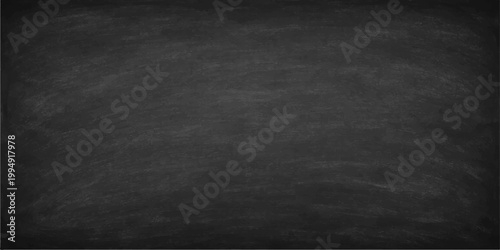 Abstract chalkboard surface, showcasing its smooth texture and providing a timeless canvas for inspiration and information. A simple yet powerful backdrop suitable for various applications.