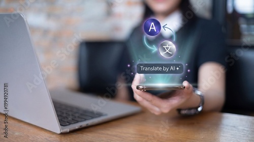 A woman using a smartphone with AI translation app next to a laptop