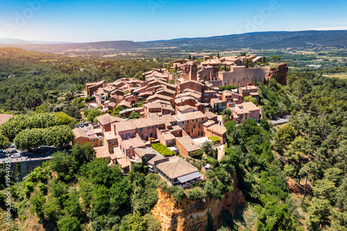 Exploring the scenic beauty of Roussillon in Vaucluse, France, Provence. Nestled atop a hill, Roussillon showcases its charming ochre buildings and stunning landscapes from Provence area.