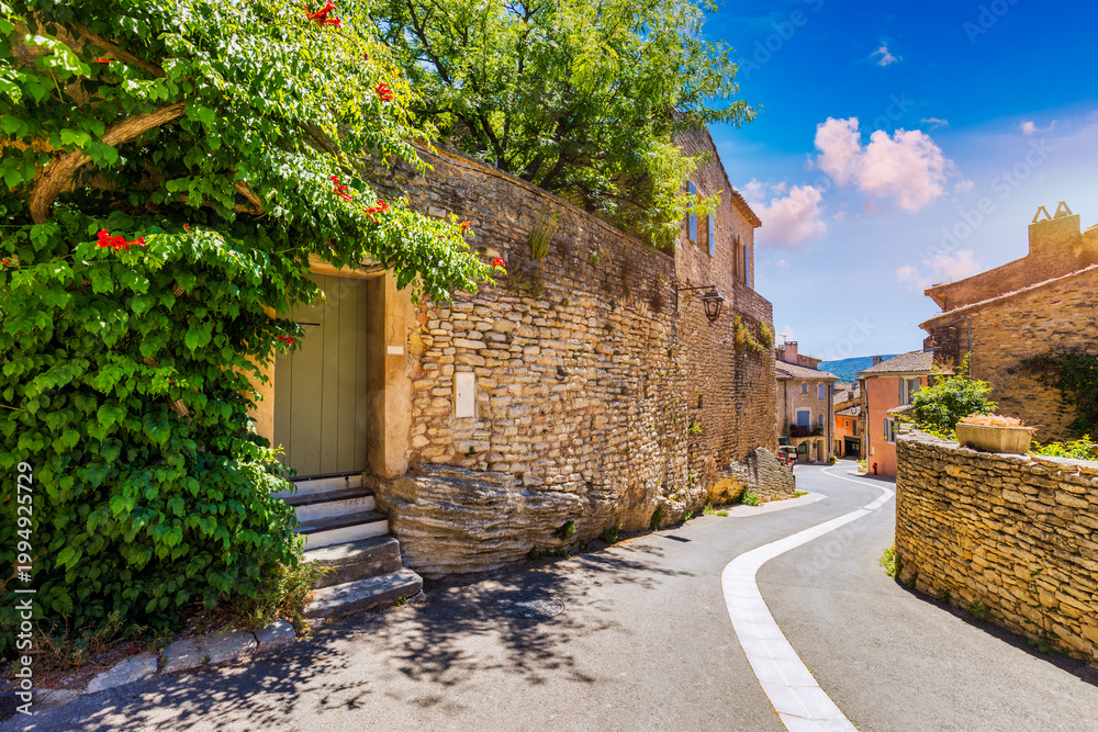 Fototapeta premium View of Goult, a small typical town in Provence, France. Discover the stunning hilltop village of Goult in Provence on a sunny day. Ancient hilltop village of Goult, Provence, France.