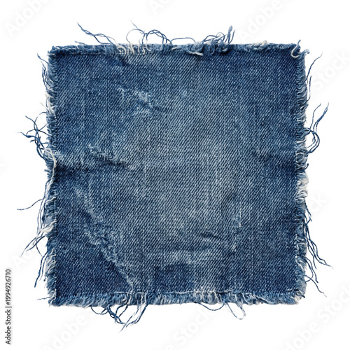 Fotografie Distressed blue denim fabric patch with frayed edges