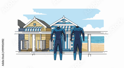 Two blue wetsuits hang in front of beach huts with a view of the ocean