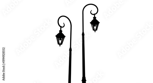 Two ornate street lamps captured in a striking black silhouette