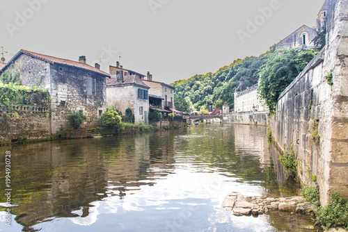 Perspective view along the Dronne river with the Benedictine Abbey dominating the right bank