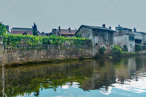 Traditional stone houses overlooking the banks of the Dronne river