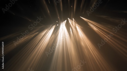 This image showcases artistic beams of light radiating from above, creating a dramatic visual effect against a dark background.