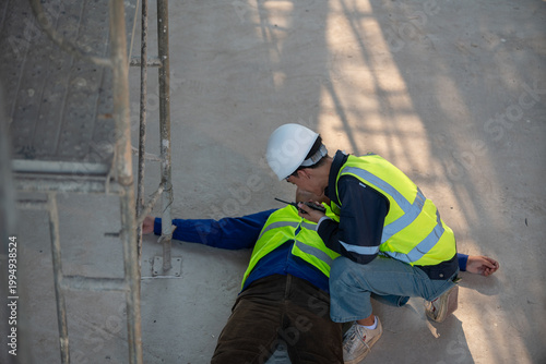 Workplace emergency response construction site photograph safety training ground level first aid