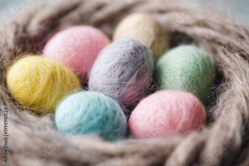 Soft Woolen Eggs in Cozy Nest, Easter Spring Celebration, Handmade Craft, Pastel Colors, Delicate Texture, Seasonal Decor, Festive Background