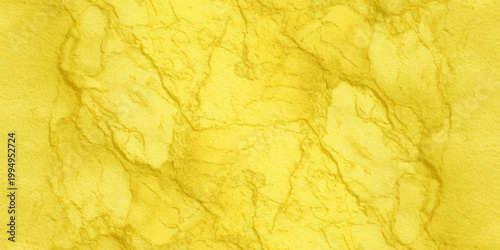 Vintage yellow paint texture on a grunge crumpled paper background featuring aged gold and orange floral patterns for an antique retro wallpaper design