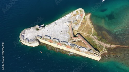 Aerial shot of St. Nicholas Fortress near Sibenik in Croatia. Old St. Nicholas fortress at Sibenik bay entrance, Dalmatia, Croatia, drone aerial shot of beautiful blue coastline seascape