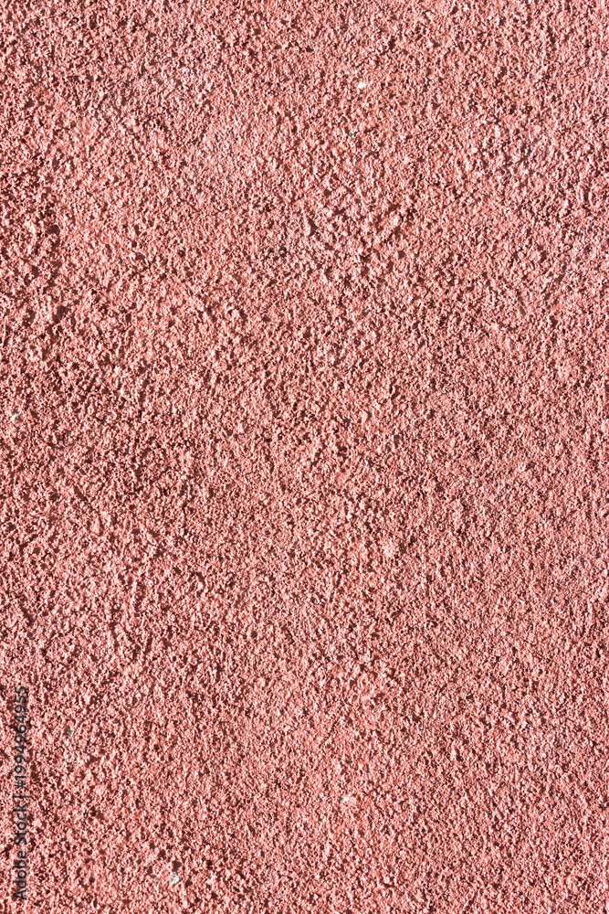 Fototapeta premium Full frame background of a dusty rose and muted purple pastel textured wall with a grainy plaster surface and weathered artistic details. Background Pattern.