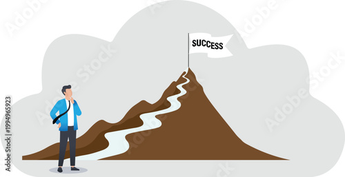 Businessman looking at a flag on top of a mountain