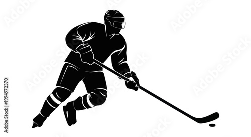 Silhouette of a hockey player skating with a puck