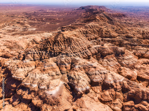 Canvastavla Vast desert landscape with eroded sandstone ridge and rugged canyon in Kazakhsta