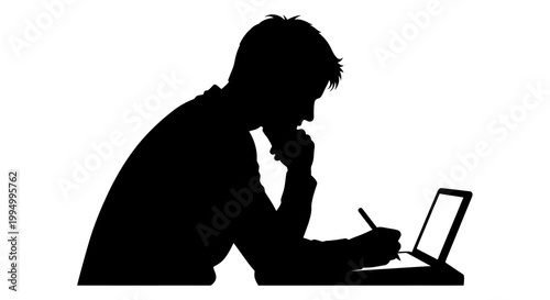Silhouette of a man thoughtfully working on a laptop computer