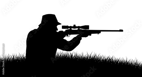 Silhouette of a hunter aiming a rifle in tall grass